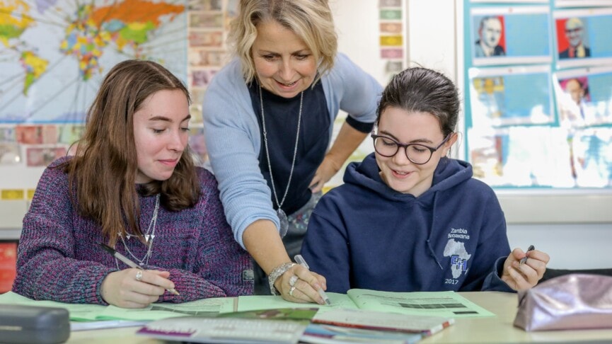 Economics Teacher With Students