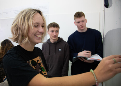 Female student at whiteboard