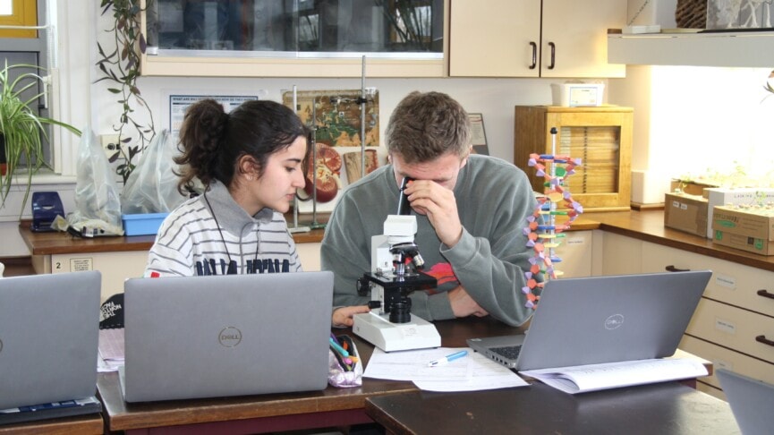 Max with microscope in biology