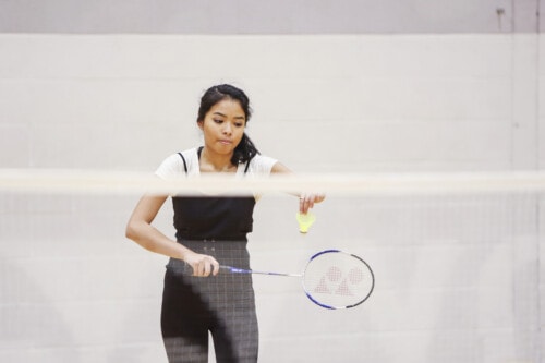 Woman playing badminton