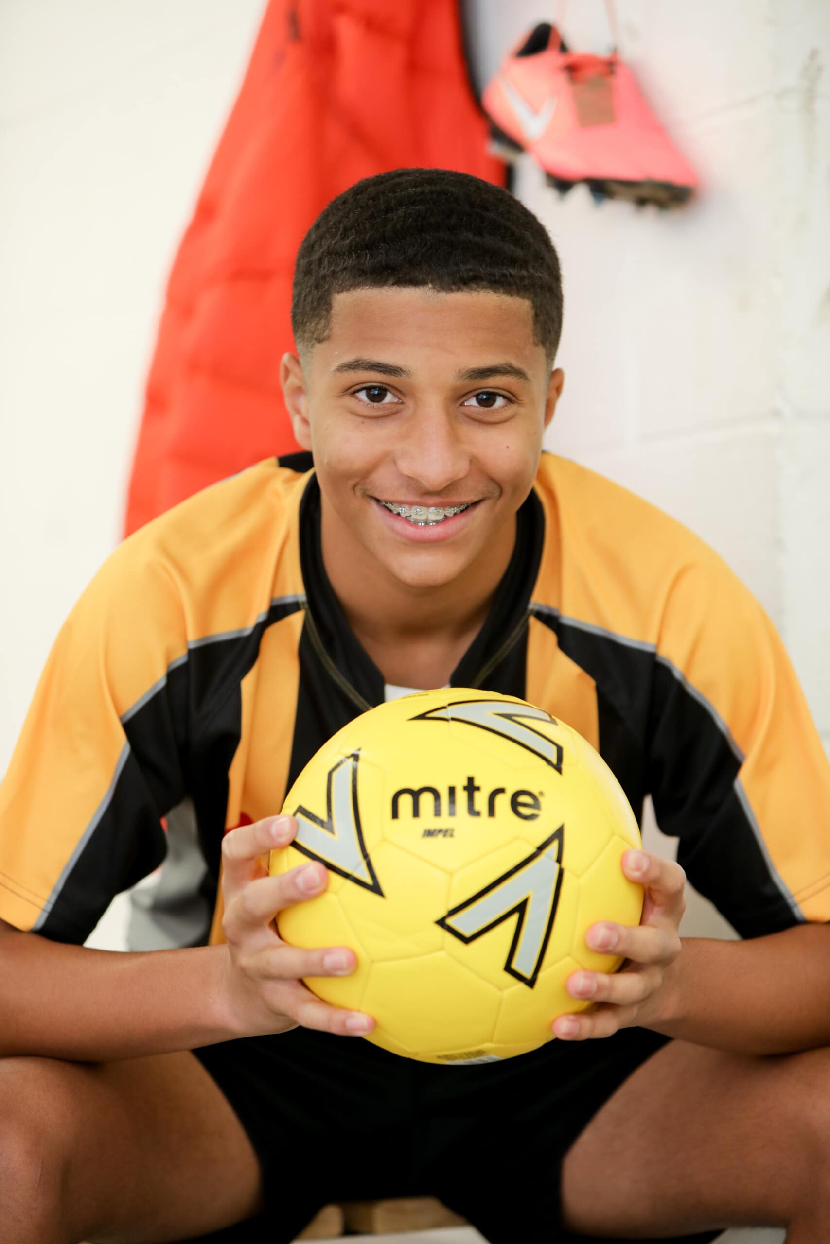 Mixed race boy with football