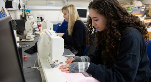 fashion student working on sewing machines
