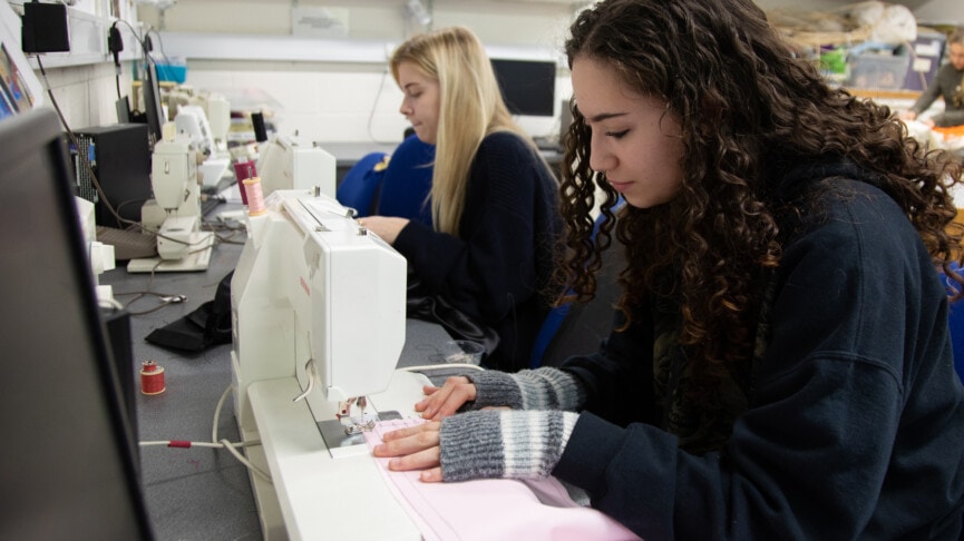 fashion student working on sewing machines