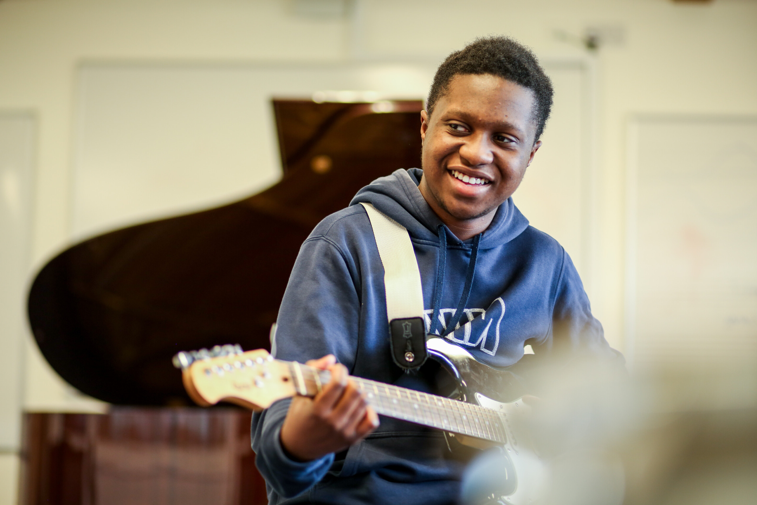 Male Student Playing Guitar